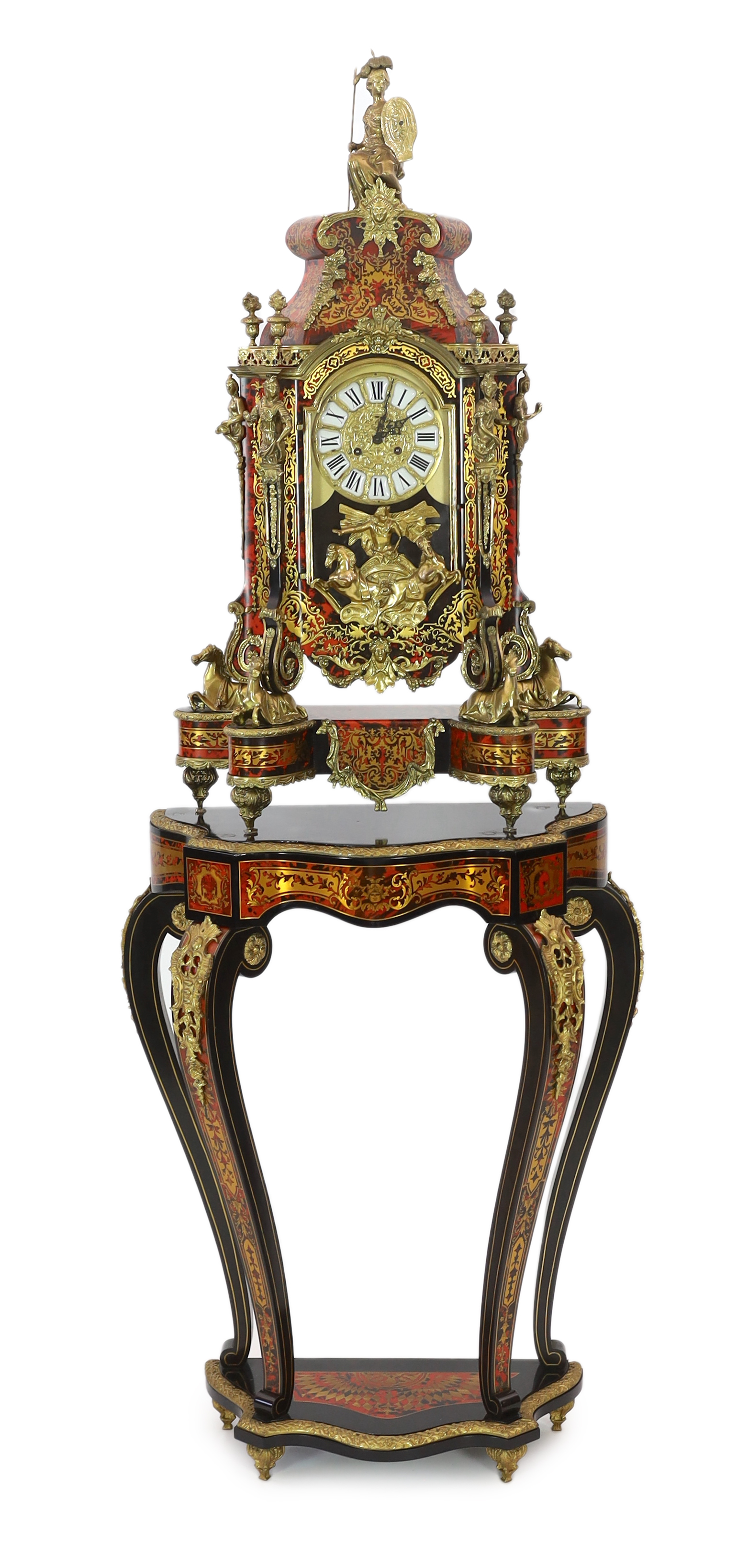 A Louis XV style brass mounted red boulle mantel clock on matching stand